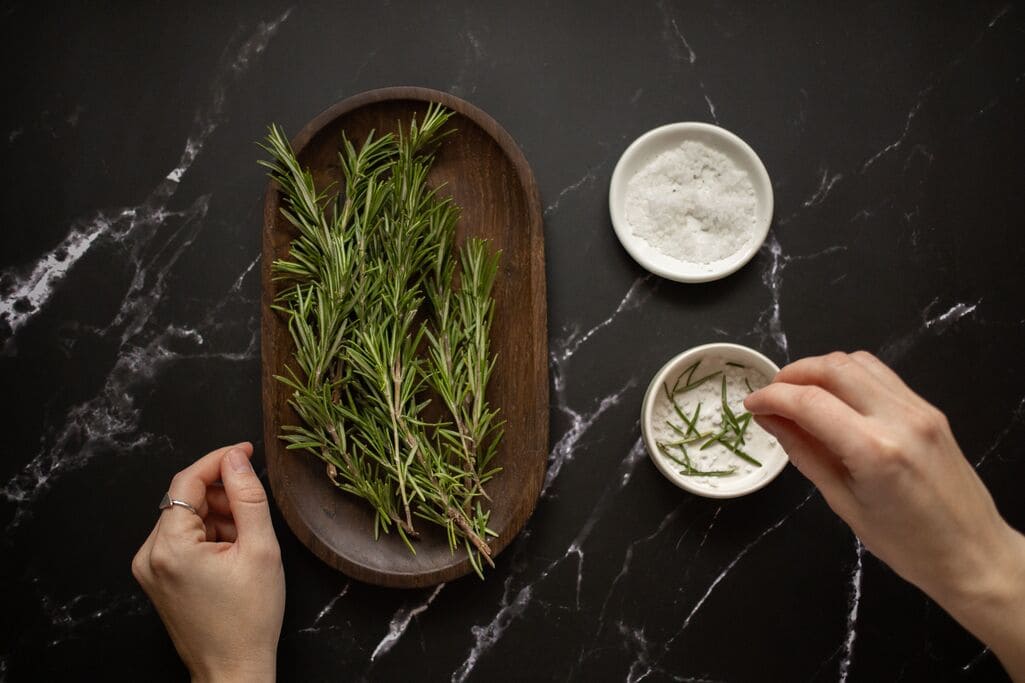 Spiritual Cleansing: Clearing What You Carry, Even When Nothing's "Wrong" 3 Sea salt and rosemary prepared for a self-cleansing ritual bath.
