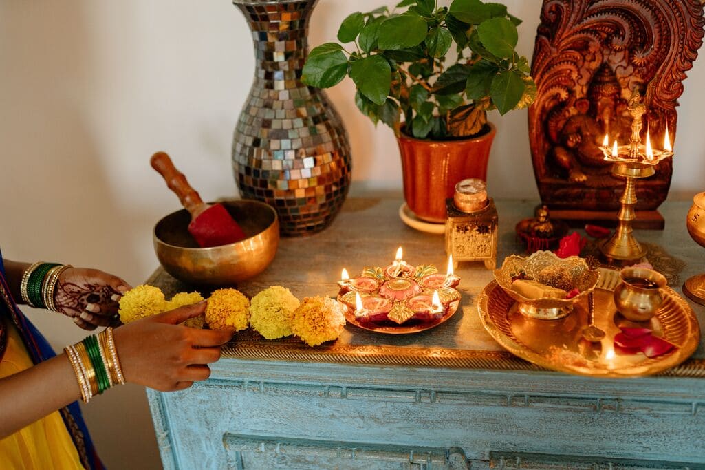 Ancestral Guidance: Listening to Those Who Came Before You 3 Arranging items for a personal ancestral altar.